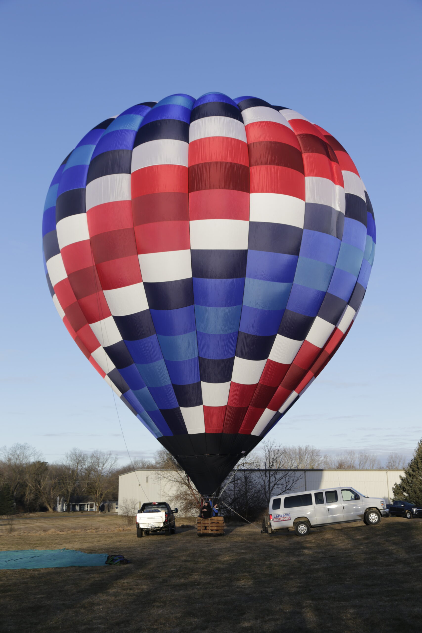 Cameron A-140 hot air balloon on ground with bright sunshine