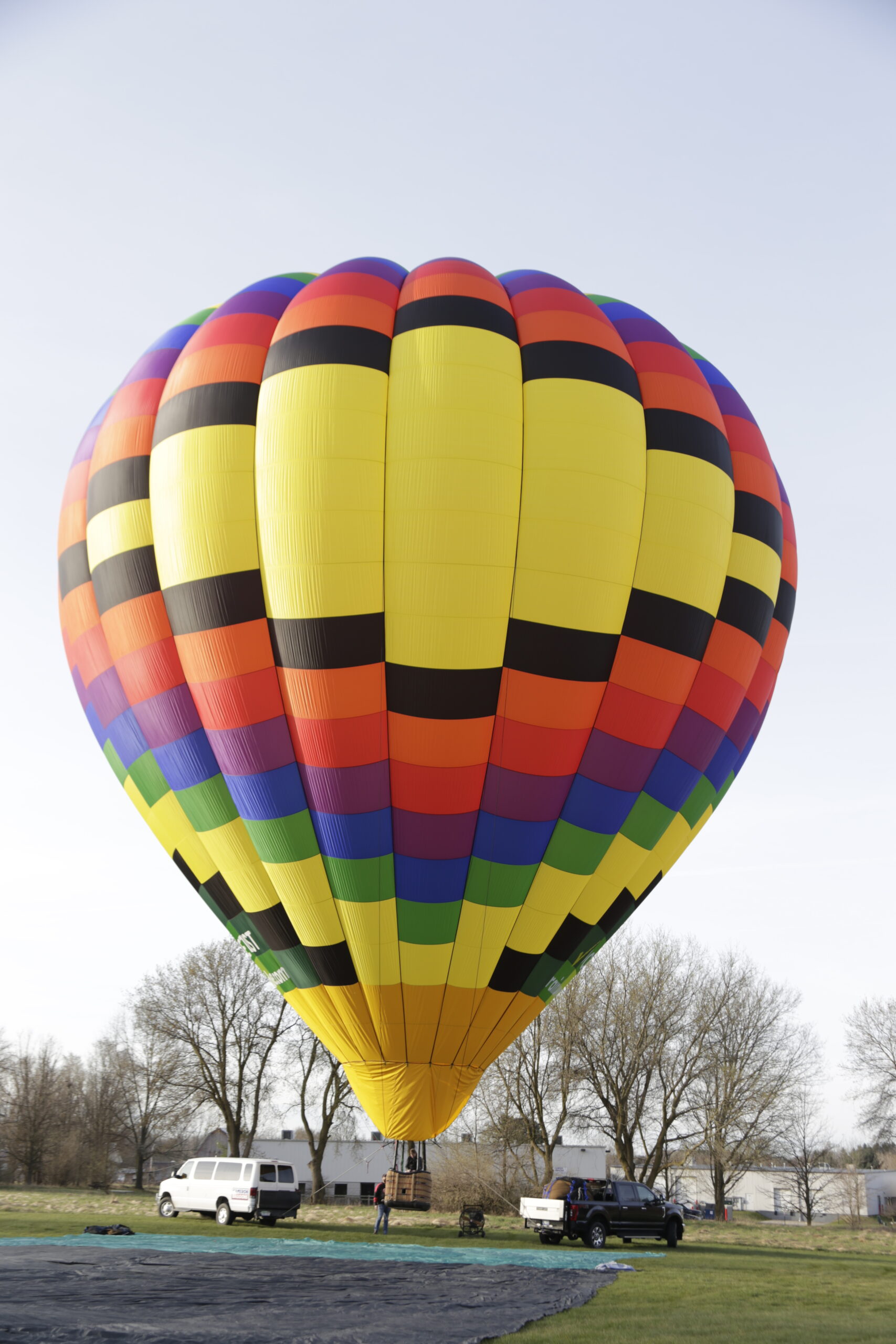 Cameron A-275 hot air balloon on ground in sunny landscape