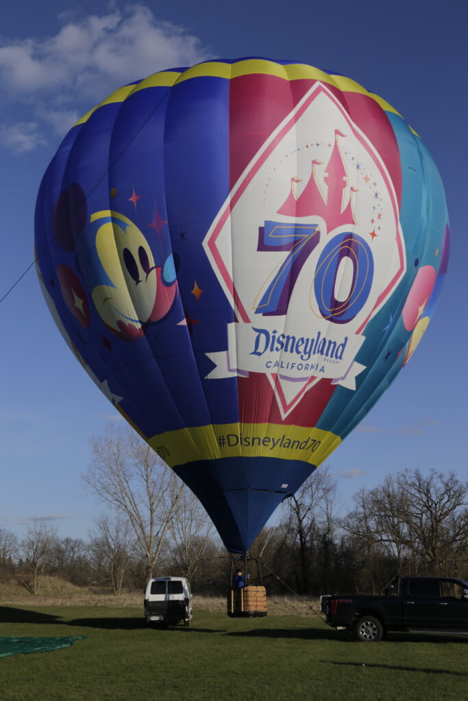 Cameron Z-90 hot air balloon with Disney 70th Anniversary custom artwork on ground