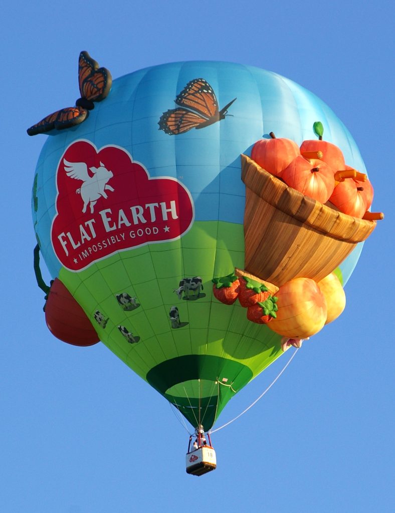 Flat Earth appendage shape on a Cameron Z-90 hot air balloon in flight over Howell, Michigan