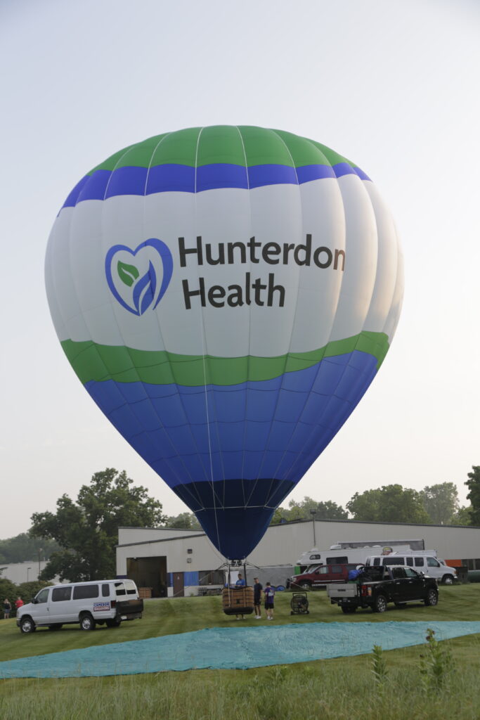 Cameron Z-90 hot air balloon with Hunterdon Health custom branding on ground