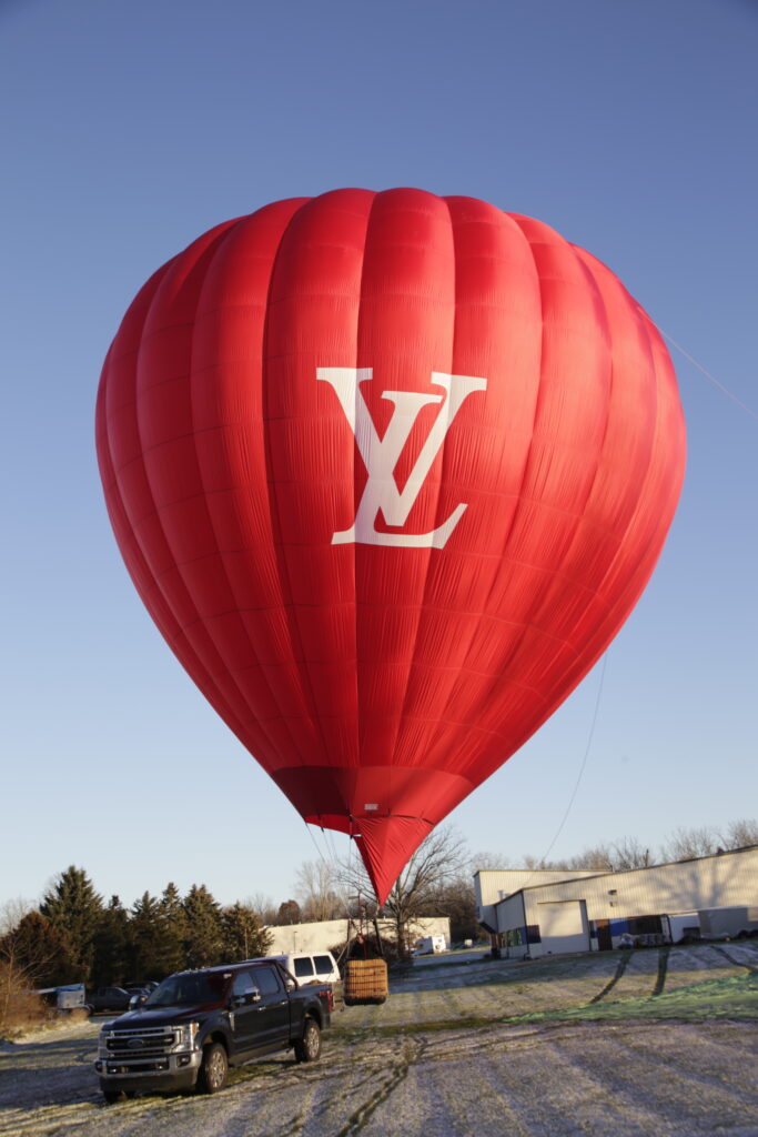 Cameron Z-90 hot air balloon with Louis Vuitton custom branding on ground
