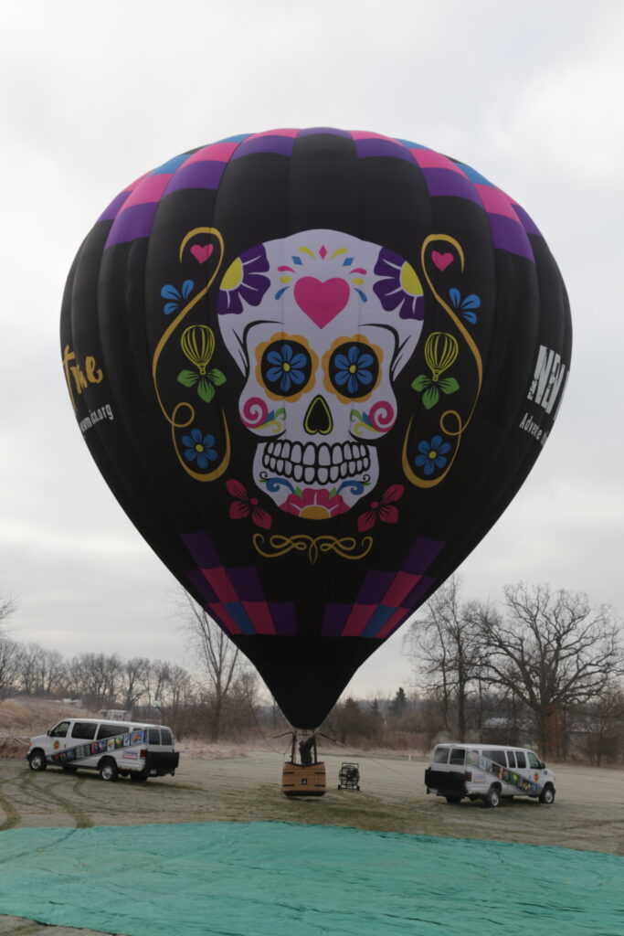 Custom inlayed and appliqued sugar skull and decorative artwork on a Cameron Z-type hot air balloon