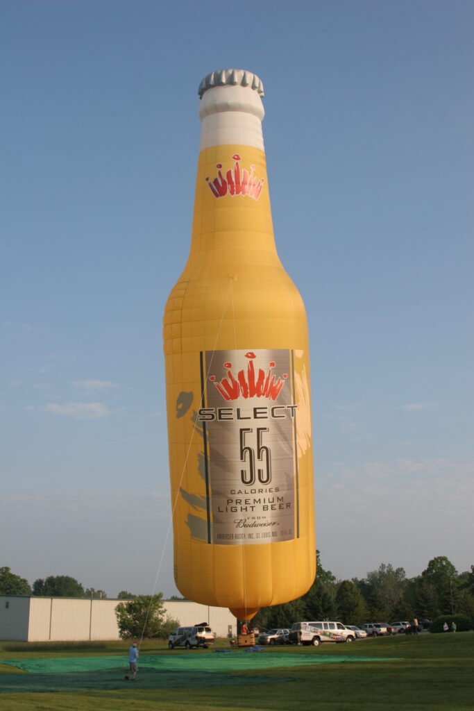 Cameron Z-type hot air balloon with Select 55 custom branding on ground