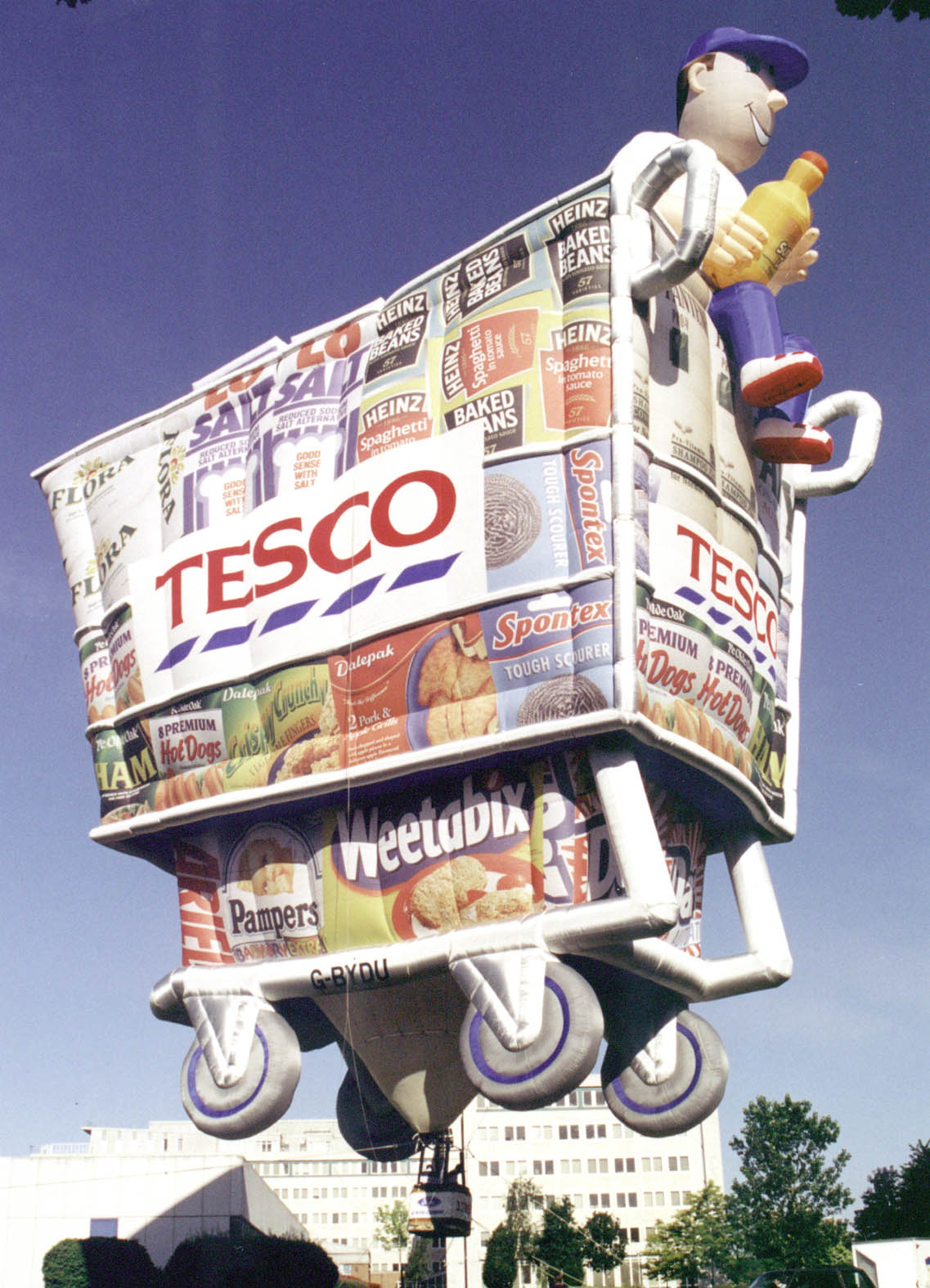 Tesco branded shopping cart with many other branded products special shape Cameron hot air balloon tethered