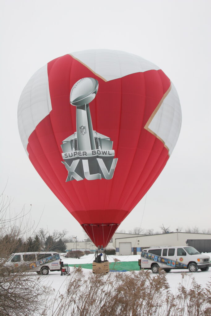 Cameron Z-type hot air balloon with Super Bowl XLV custom branding in flight