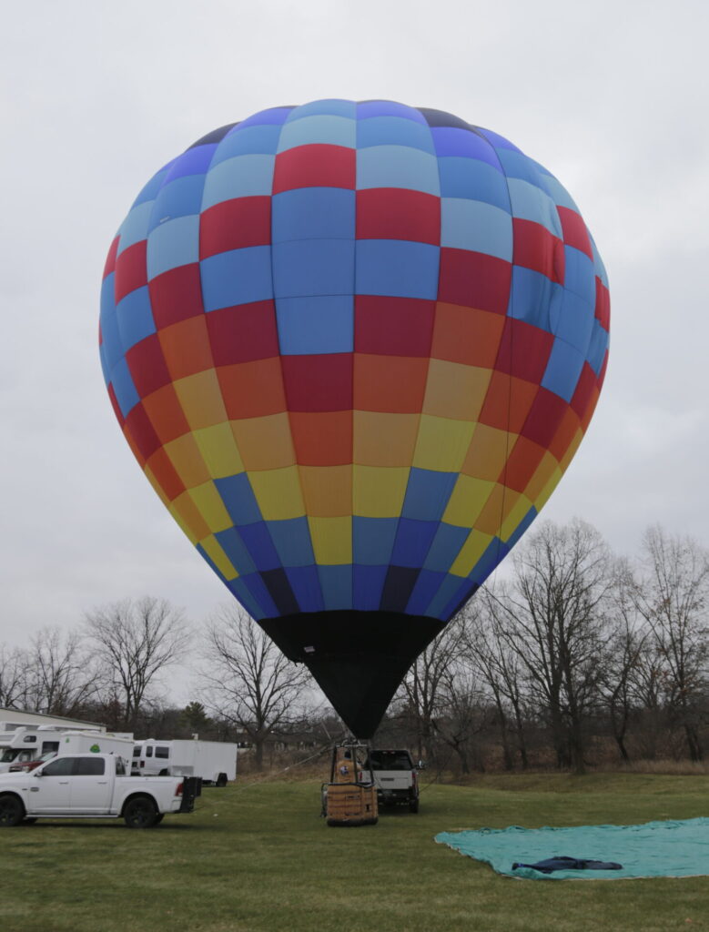 Cameron Z-90 hot air balloon on ground on a cloudy day