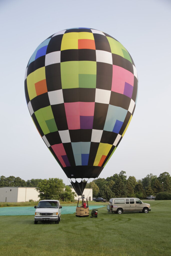 Cameron ZL-70 racer hot air balloon on ground in summertime