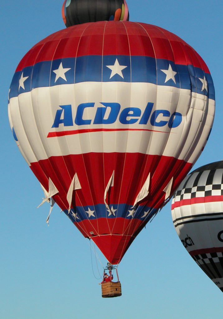 Cameron N-77 hot air balloon with custom AC-Delco branding in flight