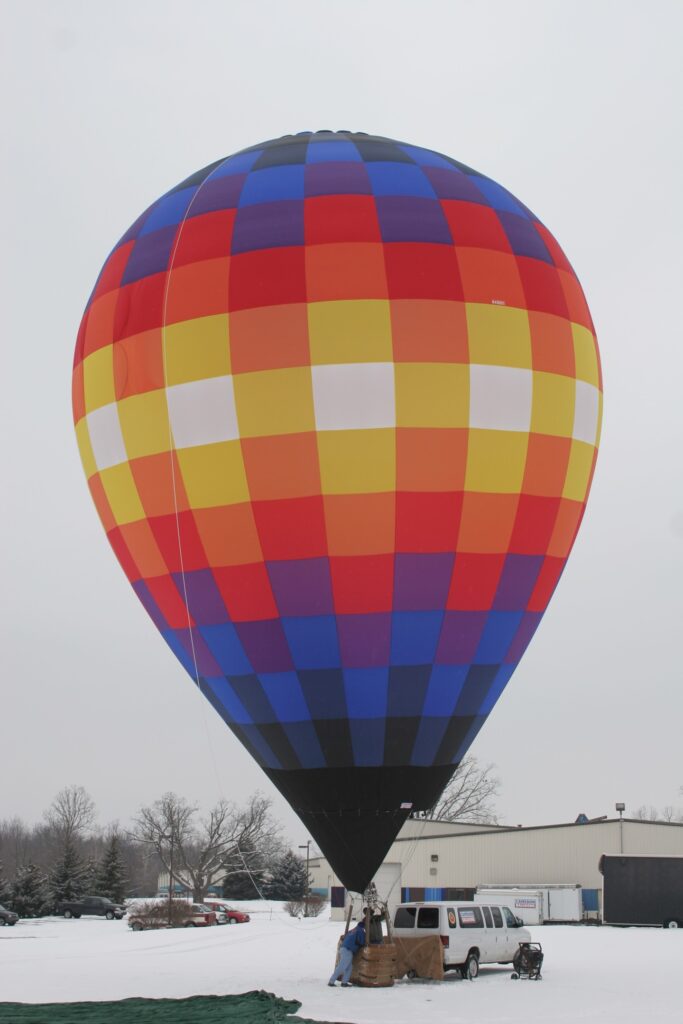 Cameron ZL-60 racer hot air balloon on ground in snow