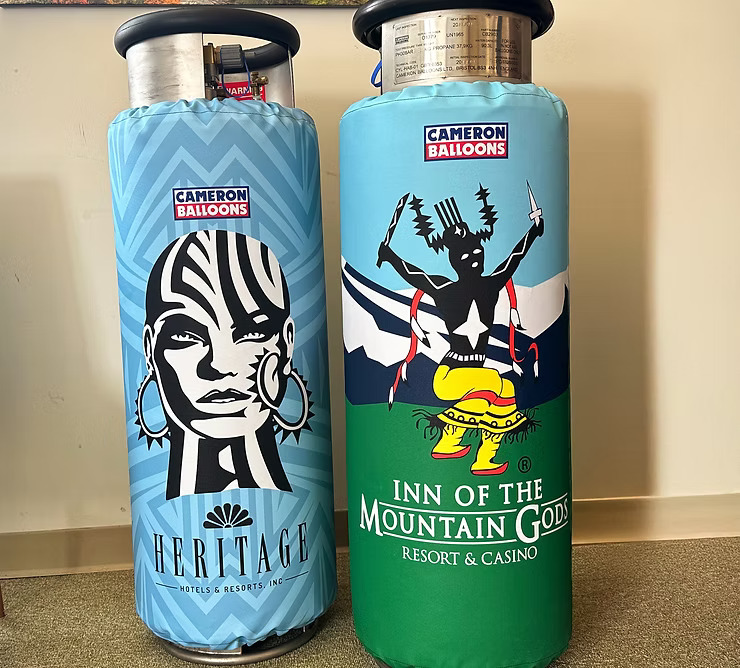 Two custom printed 15 gallon Cameron tank jackets branded for Heritage Hotels & Inn of the Mountain Gods