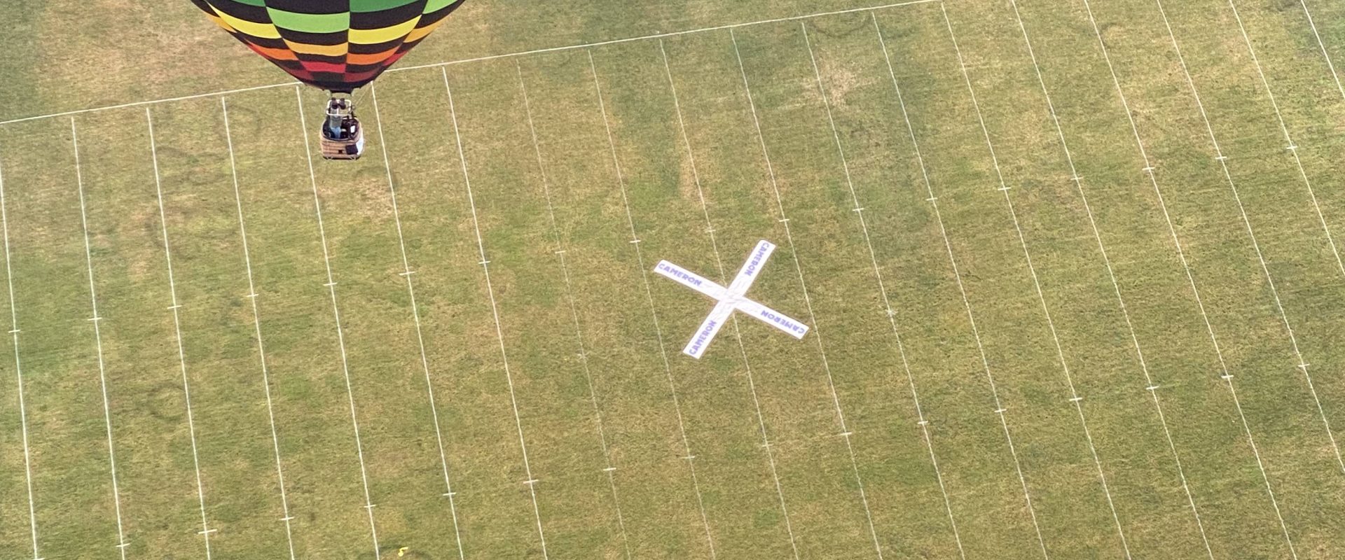 Cameron XT-60 racer hot air balloon over a target in Midland, Michigan
