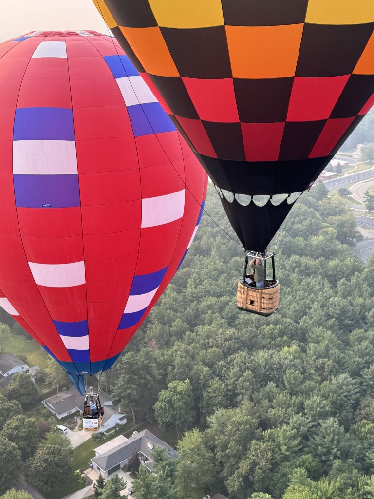 Cameron XT-60 racer hot air balloon & Cameron XT-65 racer hot air balloon in flight together over Michigan