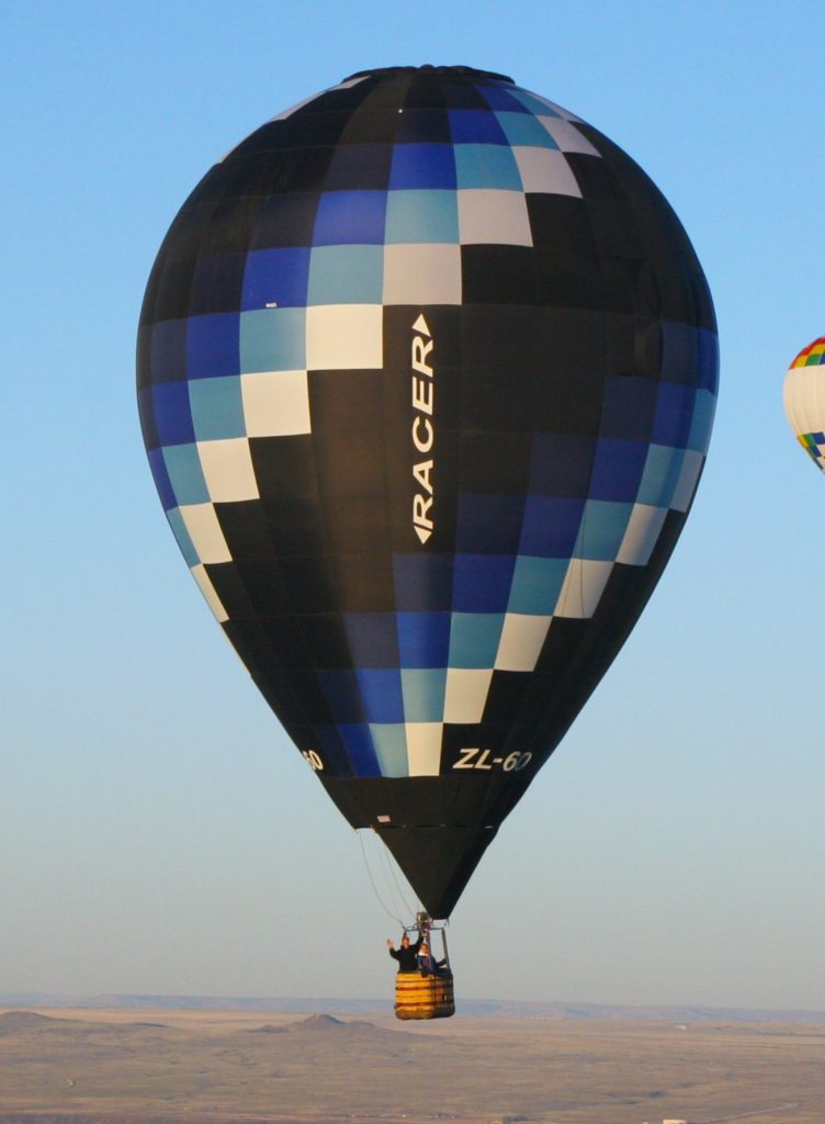 Cameron ZL-60 racer hot air balloon in flight over Albuquerque