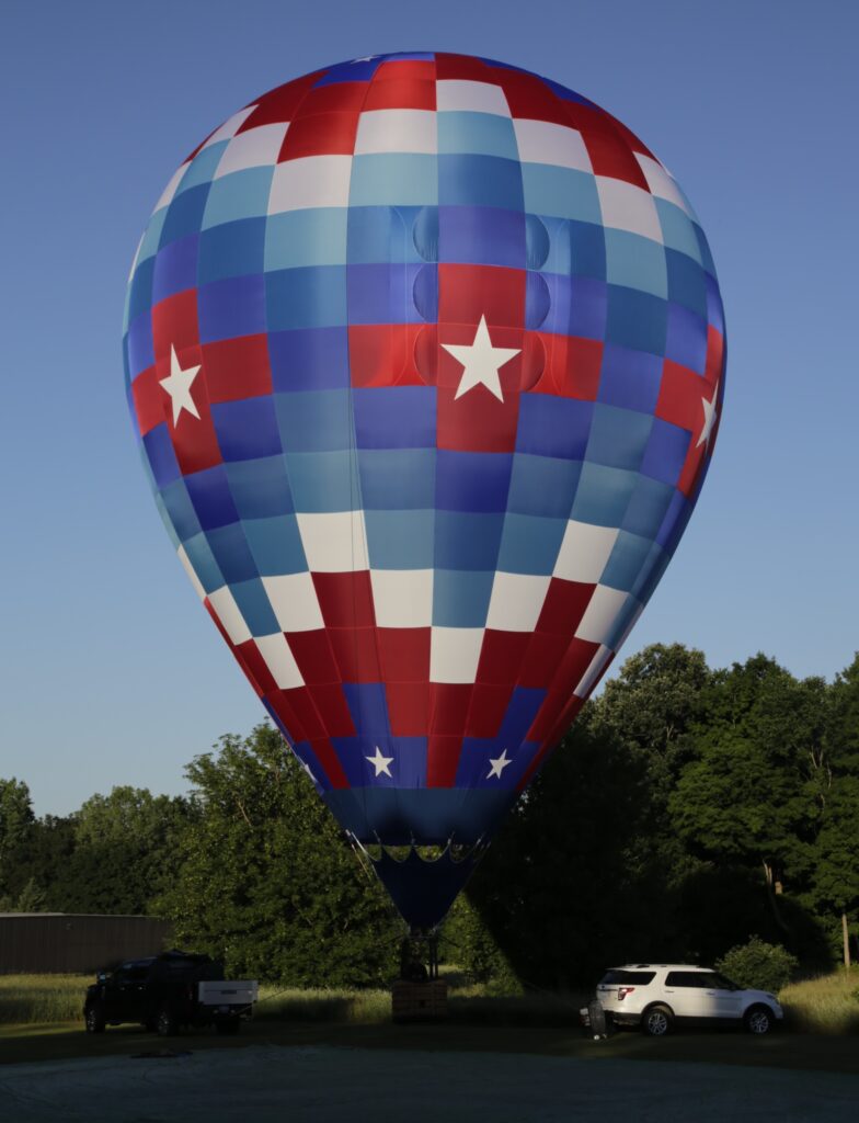 Cameron ZL-90 racer hot air balloon with custom patriotic artwork tethered